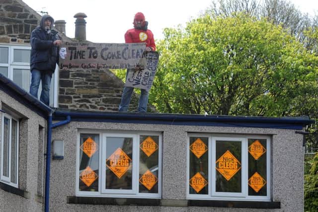Protestors on the roof of Nick Clegg's office on Nethergreen Road. Andrew Roe
