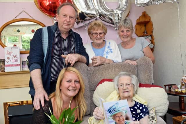 Elspeth Smith, celebrates her 105th birthday with family and friends. Amanda McKenzie, grandaughter, Ken Smith, son, Joyce Parry and Susan Cordingley, both daughters also pictured. Picture: Marie Caley NDFP 09-06-15 Smith MC 1