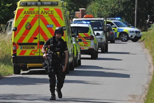 Armed police on The Cove, Westwoodside were there are reports of an armed person on the loose. Picture: Andrew Roe