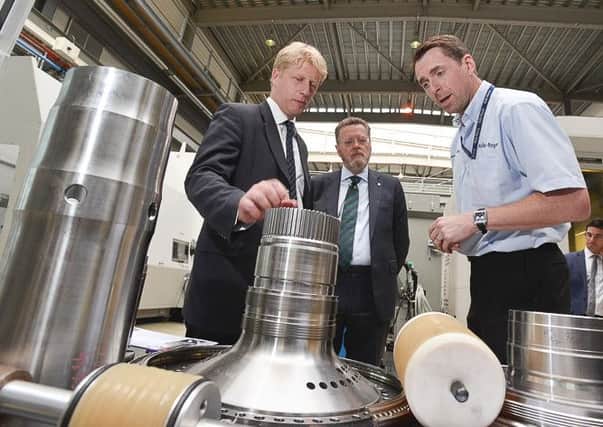 From left: Universities minister Jo Johnson, university vice chancellor Sir Keith Burnett and Dr Jamie McGourlay, AMRC Rolls-Royce partnership manager.