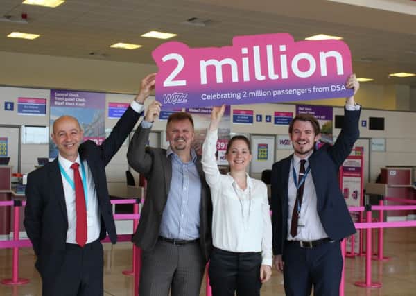 Steve Gill, airport managing director, Jozsef Ujhelyi and Kinga Frohlich, Wizzair, and Chris Harcombe, of Peel Airports