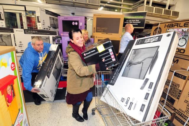Shoppers grab a Black Friday bargain at Asda last year