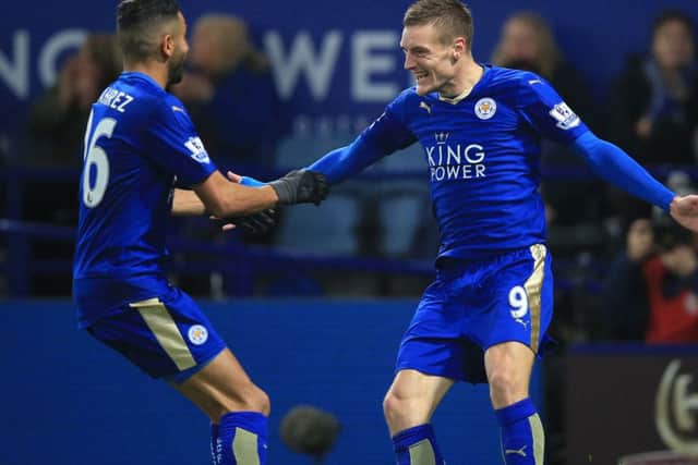 Leicester City's Jamie Vardy (right) celebrates with Riyad Mahrez after scoring his side's first goal during the Barclays Premier League match at The King Power Stadium, Leicester. PRESS ASSOCIATION Photo.