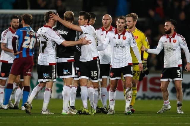 Sheffield United players celebrate their win over Scunthorpe