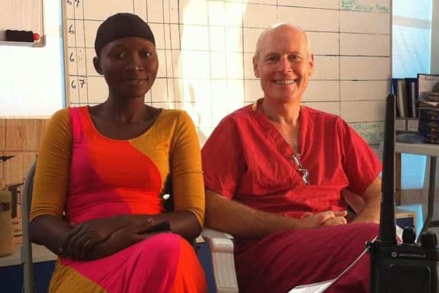 Charles Heatley with Agnes, a Community Health officer at Kerrytown Ebola Treatment Centre, Sierra Leone December 2014.