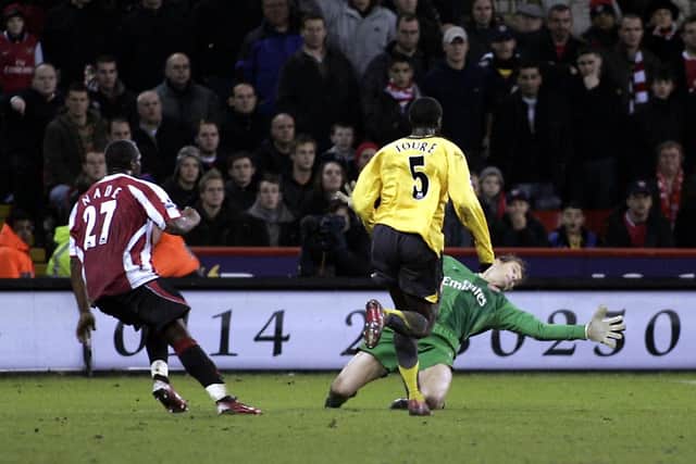 Christian Nade scores the Blades Match winning goal past Arsenal Keeper Jens Lehmann