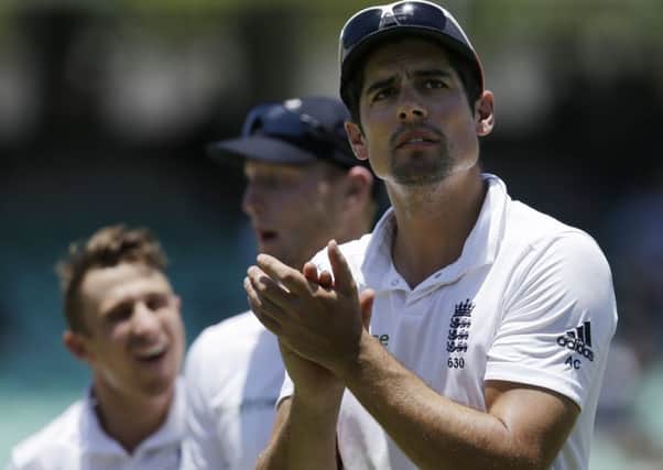 Alastair Cook applauds supporters after England complete victory in the first Test against South Africa. (AP Photo/Themba Hadebe)
