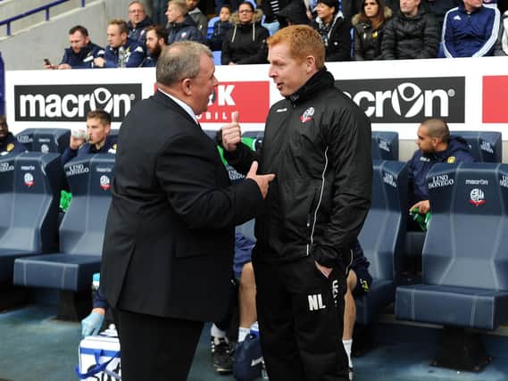 Bolton boss Neil Lennon chats with Steve Evans