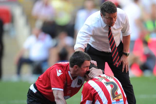 Morgan and Danny Wilson console Matty Lowton after play off defeat to Huddersfield