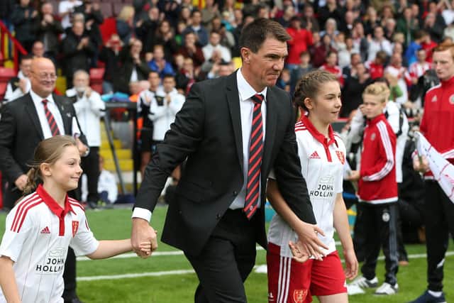 Chris Morgan walks out before his testimonial game against Newcastle in the summer