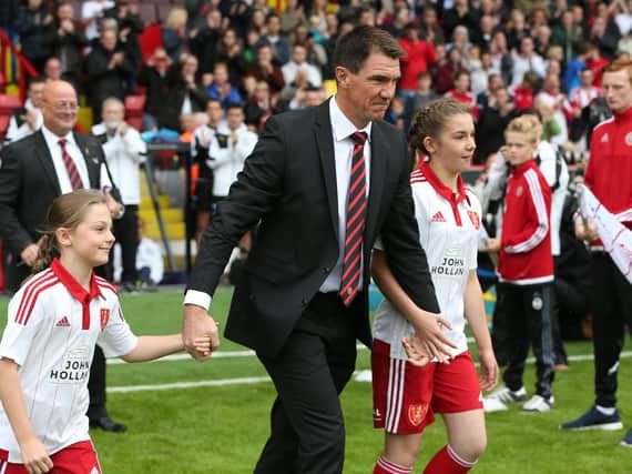 Chris Morgan walks out before his testimonial game against Newcastle in the summer