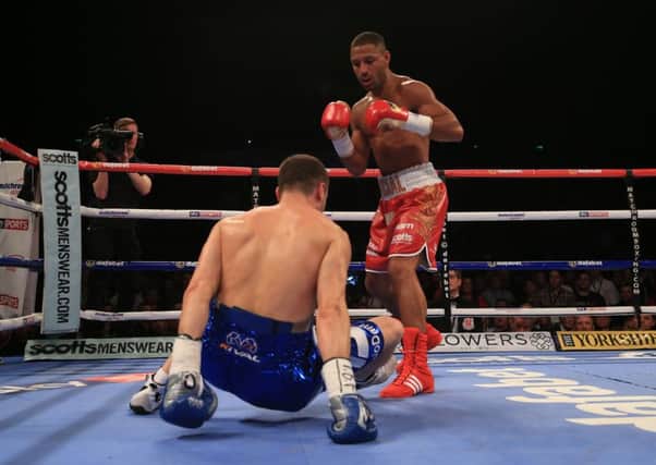 Kell Brook knocks down Jo Jo Dan during the IBF World Welterweight Championship bout at the Motorpoint Arena, Sheffield.