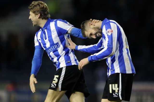 Skipper Glenn Loovens congratulates Gary Hooper on his double