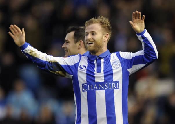 Barry Bannan celebrates his wonder strike which set the Owls on the way against Fulham. Photo: Steve Ellis