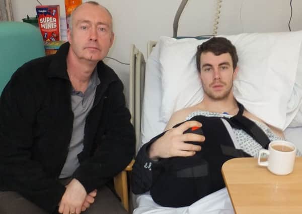 Hit-and-run victim Kyle Johnson, right, with his father, Colin, at Northern General Hospital