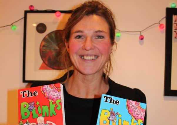 Andrea Chatten with her two The Blinks books