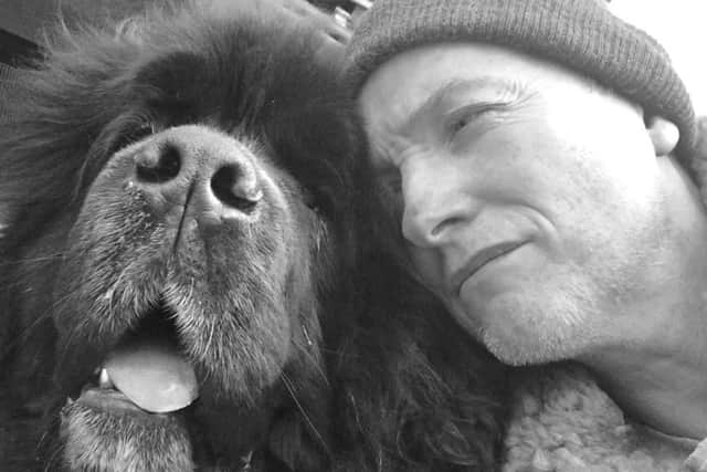 Simon Brian Cartlidge and his dog Shakespeare. He has written a book
