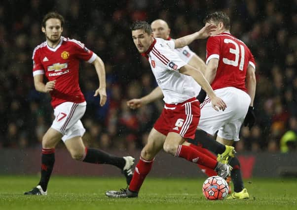 Chris Basham of Sheffield Utd evades Bastian Schweinsteiger of Manchester United