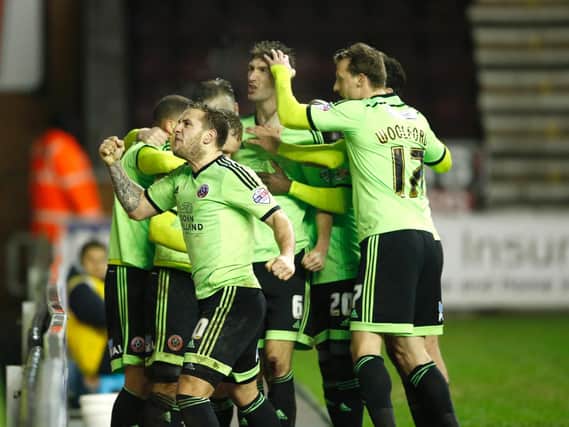 Sheffield United players celebrate after equalising in last night's 3-3 draw with Wigan