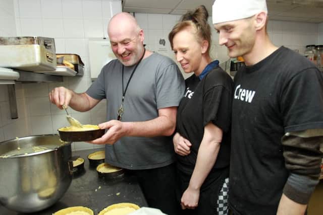 The Archer Project in Sheffield is working with a new company called Deliverd, who are running a lunch delivery service for city centre office workers, with the food prepared by homeless trainee chefs. Pictured is Head Chef Colin McFarlane with Kim and Michael.