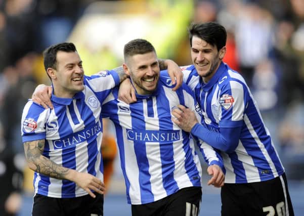 Owls two goal hero Gary Hooper celebrates with Ross Wallace and Kieran Lee