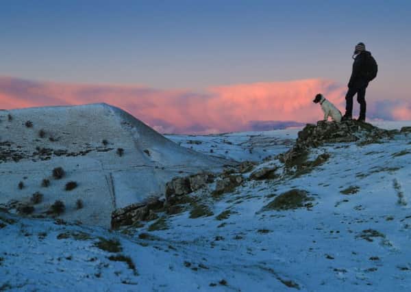 15/01/16

Rod Kirkpatrick watches the sunrise with his 15-month-old springer Spaniel, Chester.

After a dusting of snow and sub-zero overnight temperatures, dawn breaks over Chrome Hill in the upper Dove Valley in the Derbyshire Peak District.

All Rights Reserved: F Stop Press Ltd. +44(0)1335 418365   www.fstoppress.com.