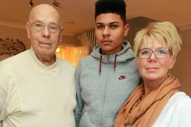 Footballer Luke Francis, now 16, who signed for SWFC academy at the age of 11, but only lasted a season, is now the subject of a compensation deal should he sign for any other club. Luke is pictured with his grandad Norman and mum Susan.