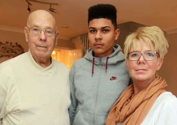 Footballer Luke Francis, now 16, who signed for SWFC academy at the age of 11, but only lasted a season, is now the subject of a compensation deal should he sign for any other club. Luke is pictured with his grandad Norman and mum Susan.