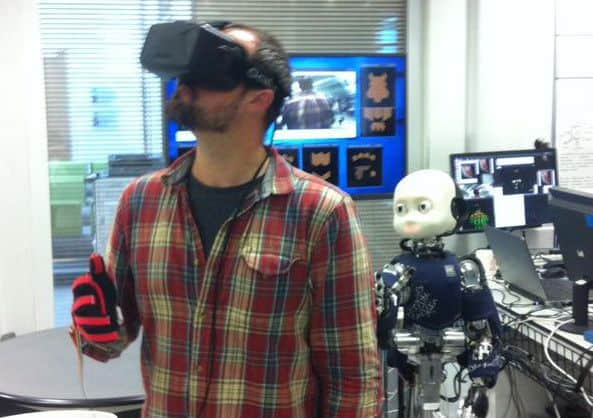 Dr Michael Szollosy experiences virtual reality courtesy of the iCub robot based in the Sheffield Robotics laboratory