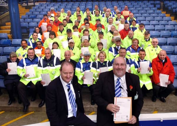 Stadium operations managerJohn Rutherford, left, and Gary Wilkinson, deputy safety officer, right, with some of the stewarding team at Sheffield Wednesday