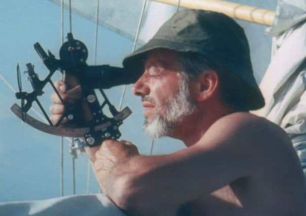 Peter Woolass, using a sextant for navigation while sailing on his yacht