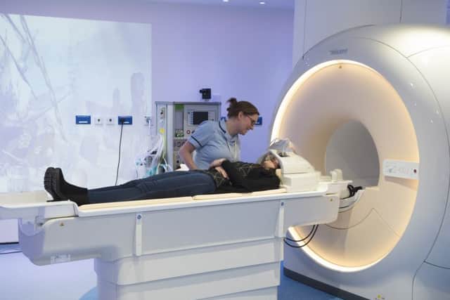 Radiologist Helen Browne reassures patient Ebony Taylor in the 3T MRI scanner