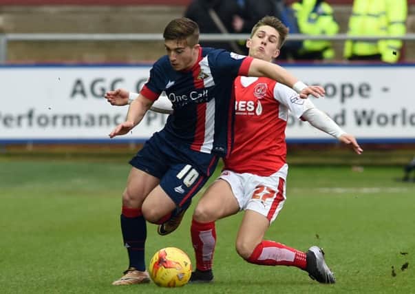 Doncaster's new boy Lynden Gooch fends off a challenge from  Fleetwood's Nick Haughton