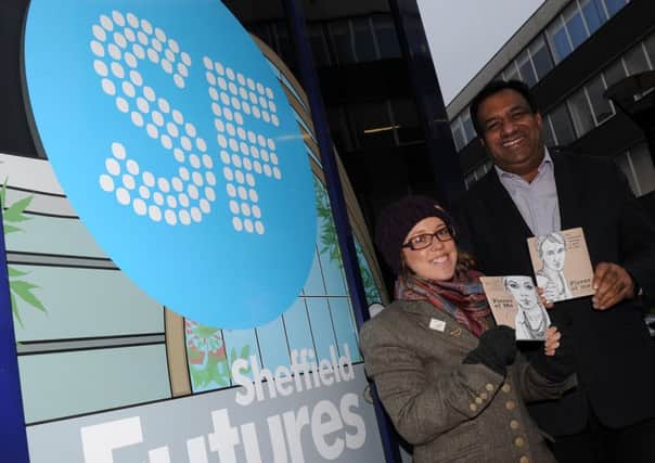 Nikki Bond and Coun Mohammad Maroof at Sheffield Futures, where they are giving away CSE books in the Nether Edge area to worthy causes. Picture: Andrew Roe