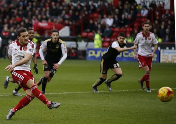 On fire Billy Sharp give the Blades the lead with  a penalty against Swindon Town. Photo:  Simon Bellis
