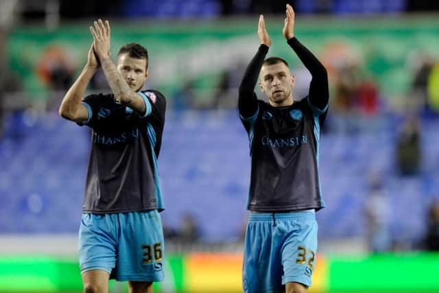 Daniel Pudil and Jack Hunt salute the Owls fans after the game