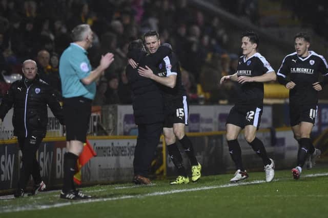 Marley Watkins and boss Lee Johnson celebrate the goal against Bradford