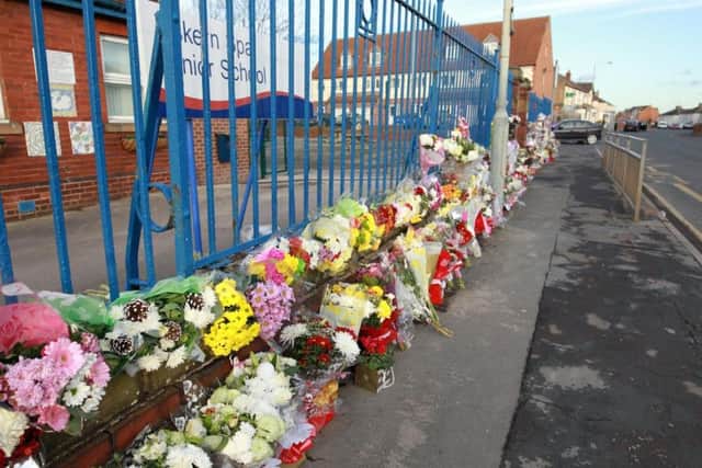 Floral tributes left at the scene of a horror crash in Sutton Road, Askern that killed three people.