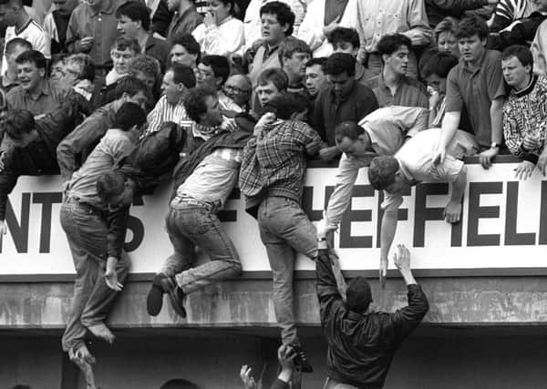 File photo dated 15/04/1989 of overcrowding at the 1989 FA Cup semi-final at Hillsborough, as the coroner presiding over the fresh inquests into the deaths of 96 Liverpool supporters at the 1989 FA Cup semi-final at Hillsborough, will begin summing up the evidence today. PRESS ASSOCIATION Photo: David Giles/PA Wire