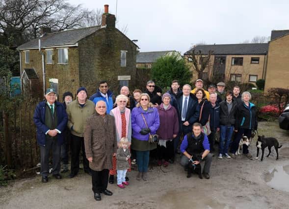 Friends of Graves Park members and supporters of the petition outside the cottage in Graves Park which they are trying to save. Picture: Andrew Roe