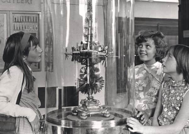 L to R Susan James 10, Sarah Neale 10 and Sally McCulloch 11, admire the Year Knife on display in Weston Park museum, July 1971.