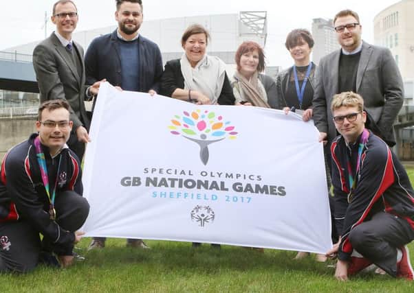 Niall Guite, David Richards, David Briggs, Karen Wallin, Michelle Guite, Jayne Thompson, Tom Barker and Alexander Thompson with the new Special Olympics logo
