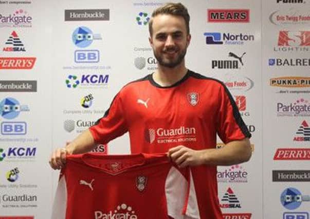 Andrew Shinnie signs in