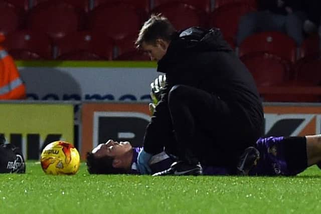 Thorsten Stuckmann receives treatment after landing heavily.