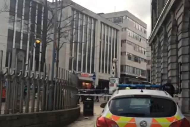 Police cordoned off an area of pavement on Market Place near to the Bankers Draft pub