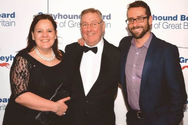 Harry Crapper, centre, who has been a  Lifetime Achievement Award for his services to the greyhound industry, with his son Stephen and daughter-in-law Adele