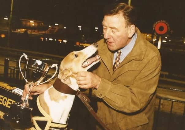 Harry Crapper, who has been a  Lifetime Achievement Award for his services to the greyhound industry, with one of the many greyhounds he trained