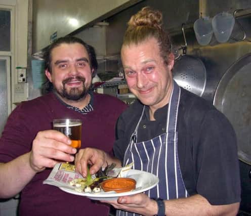 Tom Harrington & chef Tom Gibson-Howarth with a plate of CalÃ§ots & Romesco