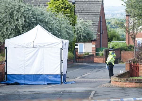 Police outside the scene of the murder on Bluebell Close, Wincobank.
