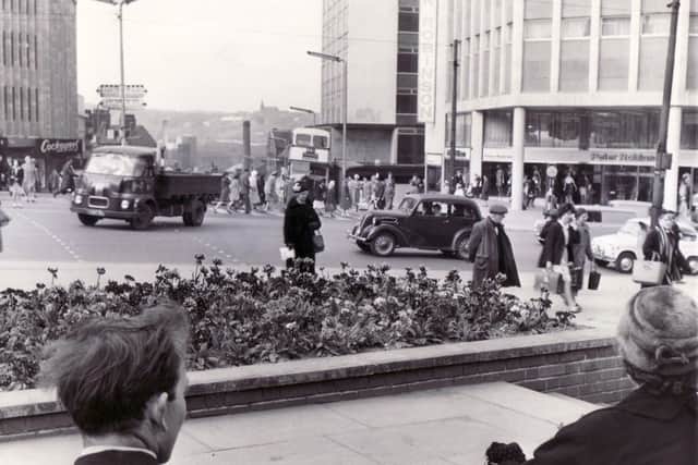 'Blooming Sheffield' in 1962 - Picture shows the junction of High Street and Angel Street taken from the end of Change Alley.
Peter Robinson's on the right and Cockayne's Department Store to the left.

Sheffield